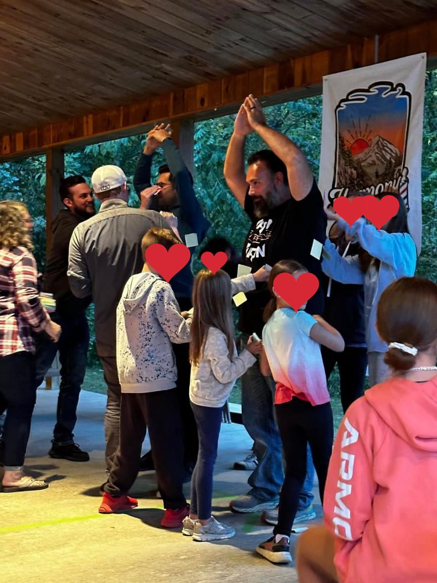 Kids and adults singing along at the camp show